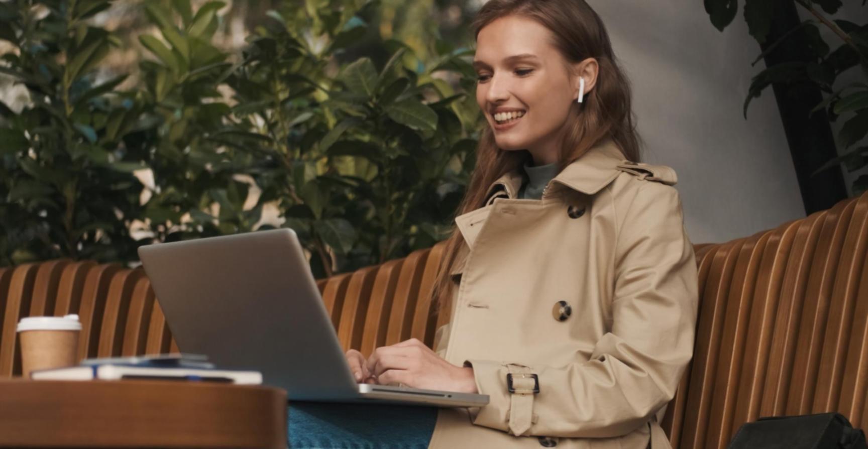Person reviewing financial documents with calculator and charts